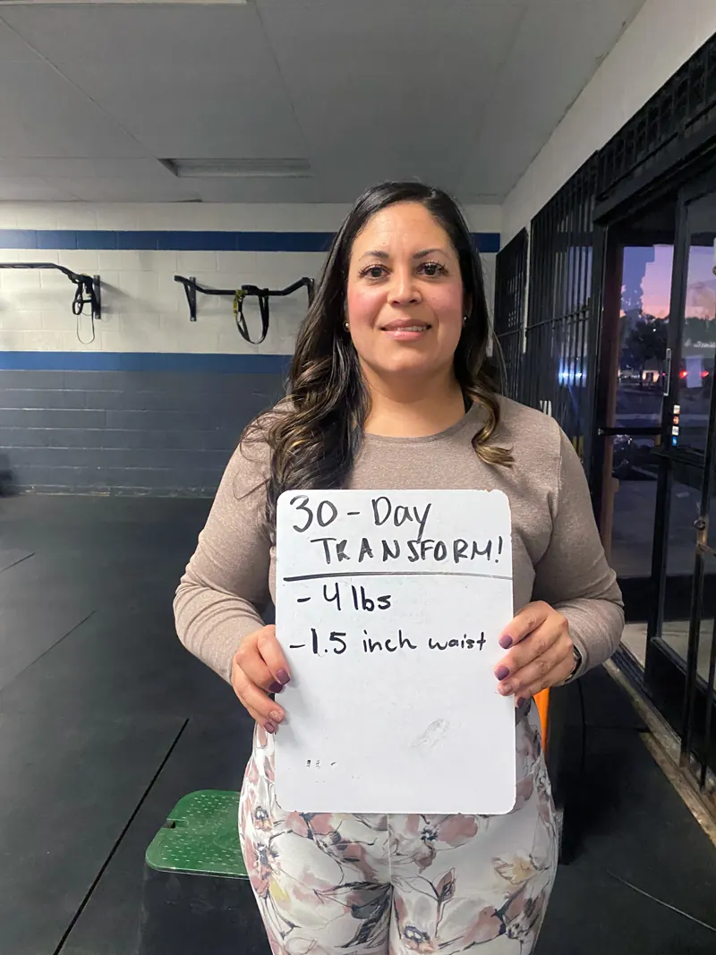 Member celebrating a 30-day body transformation