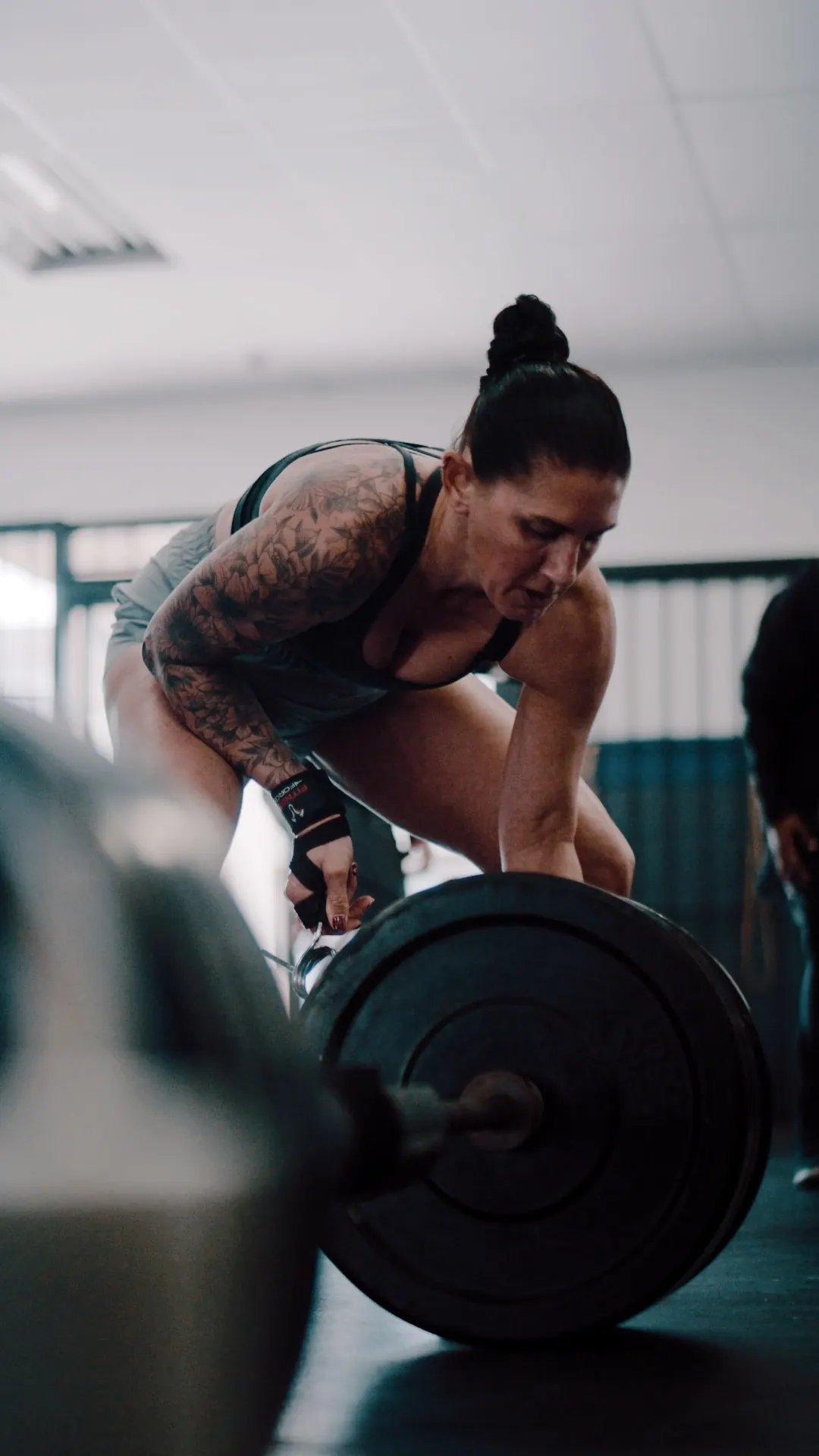 Woman barbell strength training at Latitude 32 Fitness